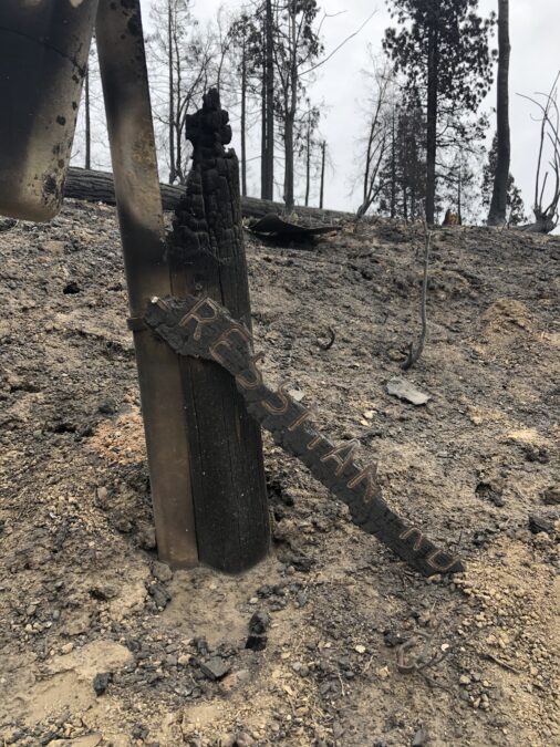 Creek fire destroyed private road sign